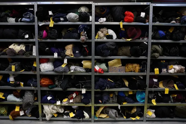 A collection of clothing items occupies shelves at Transport for London’s Lost Property Office, among thousands of items lost by commuters and stored in Europe’s largest lost property warehouse, in London, Britain, November 24, 2025. (Reuters) 
