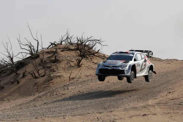  French driver Sebastien Ogier and his French co-driver Vincent Landais compete in their Toyota GR Yaris during stage 5 of the FIA World Rally Championship (WRC) in Jeddah on November 27, 2025. (AFP) 