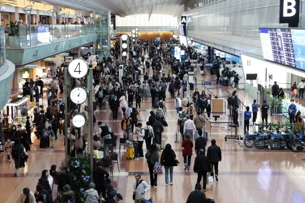 Haneda Airport’s Terminal 2 is crowded with travellers due to flight cancellations, in Tokyo, Japan, 29 November 2025. (EPA/Jiji Press)
