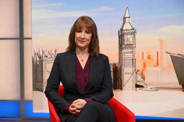 A handout picture released by the BBC, taken and received on November 30, 2025, shows Britain's Chancellor of the Exchequer Rachel Reeves appearing on the BBC's 'Sunday Morning' political television show with journalist Laura Kuenssberg. (Photo by JEFF OVERS / BBC / AFP) 