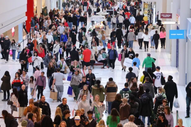 Shoppers browse through stores at Mall of America for Black Friday deals, Friday, Nov. 28, 2025, in Bloomington, Minn. (AP Photo/Adam Bettcher)
