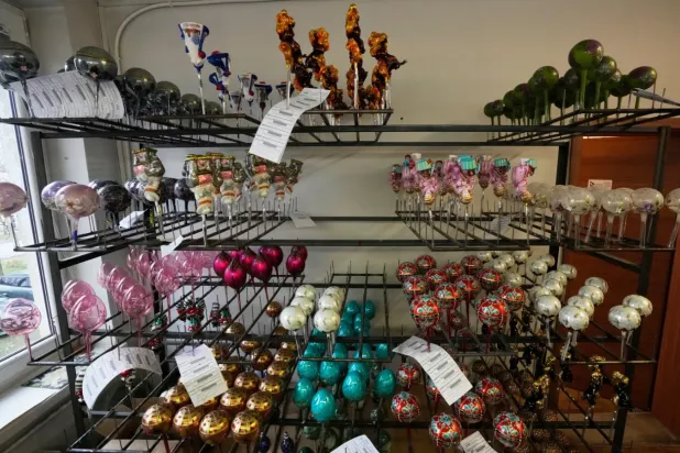 The hand-made Christmas baubles are prepared at GlitterLab in Czestochowa, southern Poland, on Nov. 21, 2025. (AP Photo/Czarek Sokolowski)