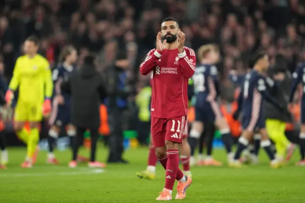 Liverpool’s Mohamed Salah applauds after the Champions League opening phase soccer match between Liverpool and PSV in Liverpool, England, Wednesday, Nov. 26, 2025. (AP Photo/Jon Super)

