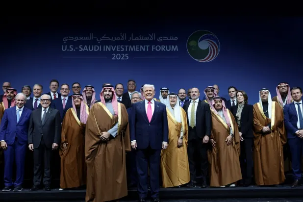 Prince Mohammed bin Salman, Saudi Crown Prince and Prime Minister, and US President Donald Trump pose for a family picture during the Saudi-US Investment Forum in Washington, DC, US, November 19, 2025. (Reuters) 