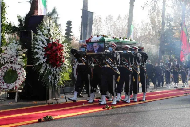 Members of Iranian forces carry the coffin of Iranian nuclear scientist Mohsen Fakhrizadeh during a funeral ceremony in Tehran, November 30, 2020. (Reuters) 