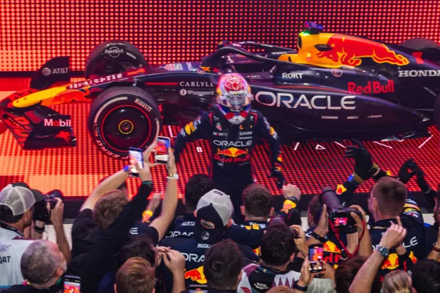  Red Bull Racing's Dutch driver Max Verstappen celebrates with his team after winning the Formula One Qatar Grand Prix at the Lusail International Circuit in Lusail on November 30, 2025. (AFP) 