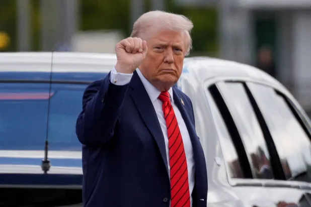 US President Donald Trump gestures as he departs Walter Reed National Military Medical Center following his annual physical exam, in Bethesda, Maryland, US, October 10, 2025. (Reuters)