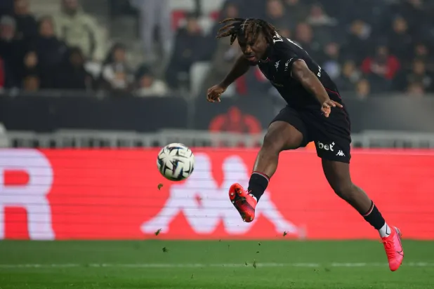 Nice's Nigerian forward #09 Terem Moffi kicks the ball during the French L1 football match between OGC Nice and Olympique de Marseille (OM) at the Allianz Riviera stadium in Nice, south-eastern France, on November 21, 2025. (Photo by Valery HACHE / AFP)