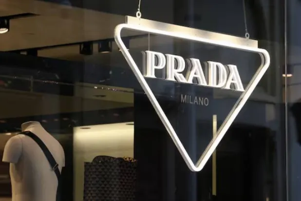 The logo of Prada is seen in a shop in Paris, France, February 12, 2023. REUTERS/Yves Herman/File Photo 