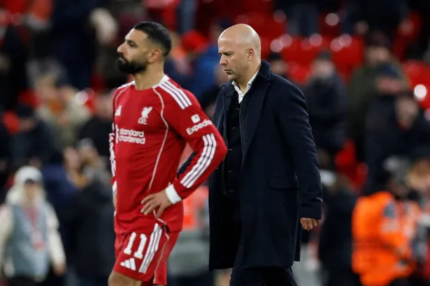 Soccer Football - UEFA Champions League - Liverpool v PSV Eindhoven - Anfield, Liverpool, Britain - November 26, 2025 Liverpool manager Arne Slot and Liverpool's Mohamed Salah after the match Action Images via Reuters/Jason Cairnduff    