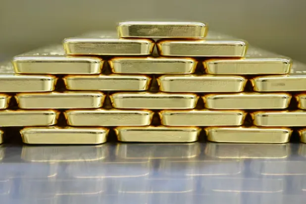 Gold bars are stacked in the safe deposit boxes room of the Pro Aurum gold house in Munich, Germany, January 10, 2025. REUTERS/Angelika Warmuth
