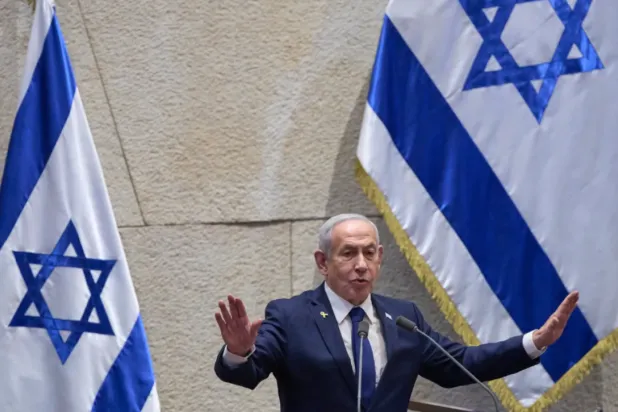 Israel’s Prime Minister Benjamin Netanyahu addresses lawmakers in the Knesset, Israel’s parliament, in Jerusalem, Monday, Nov. 10 2025. (AP Photo/Ohad Zwigenberg)
