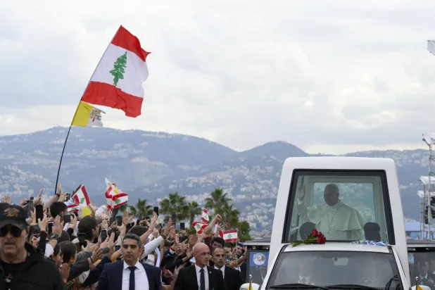 A handout picture provided by the Vatican Media shows Pope Leo XIV greeting the faithful on the day he celebrated a Holy Mass at the Beirut Waterfront, during his apostolic journey, in Beirut, Lebanon, 02 December 2025. EPA/VATICAN 
