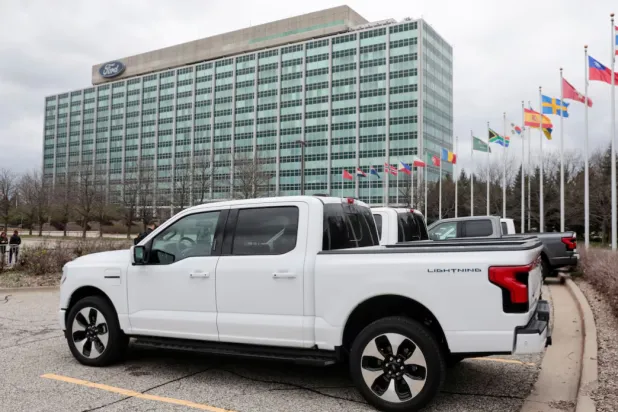 A model of the all-new Ford F-150 Lightning electric pickup is parked in front of the Ford Motor Company World Headquarters in Dearborn, Michigan, US April 26, 2022. REUTERS/Rebecca Cook 
