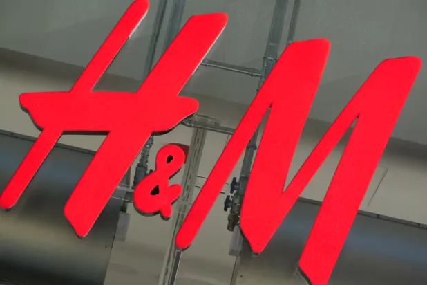 The logo for H&M is displayed outside a store in Stockholm, Sweden, September 23, 2025. REUTERS/Tom Little