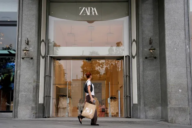 FILE PHOTO: A person walks by a Zara store in Plaza de Espana in Madrid, Spain, June 11, 2025. REUTERS/Ana Beltran/File Photo