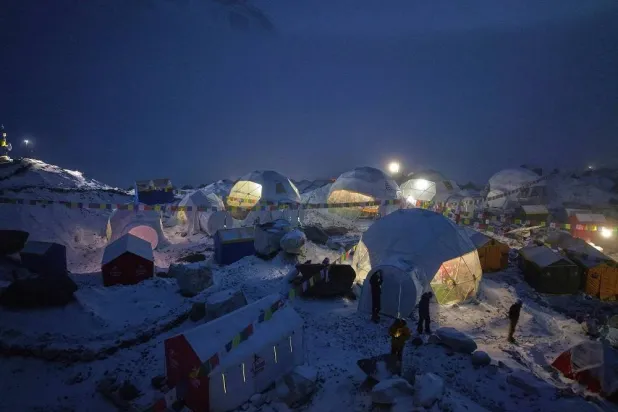Members of an expedition to reach the summit of Mount Everest stand by their tents at the Everest Base Camp in Nepal on April 28, 2025. (AP)