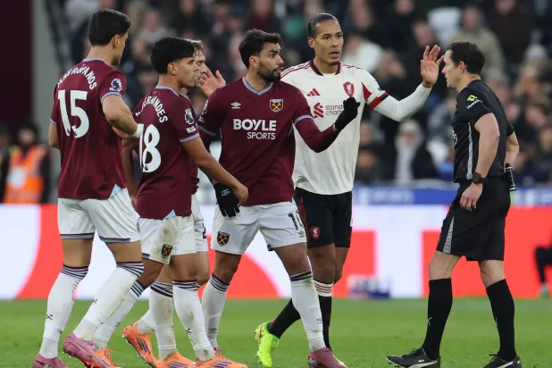 West Ham's Lucas Paqueta (C) argues with referee Darren England (R) causing him to be sent off during the English Premier League match between West Ham and Liverpool in London, Britain, 30 November 2025. EPA/NEIL HALL