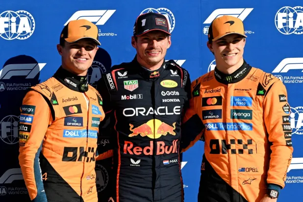 F1 - Italian Grand Prix - Autodromo Nazionale Monza, Monza, Italy - September 6, 2025 Red Bull's Max Verstappen poses after qualifying in pole position with second placed McLaren's Lando Norris and third placed McLaren's Oscar Piastri. (Reuters)