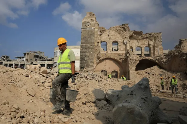  Workers carry out restoration work at the historical Pasha's Palace, damaged during the war, in Gaza City, November 11, 2025. (Reuters)