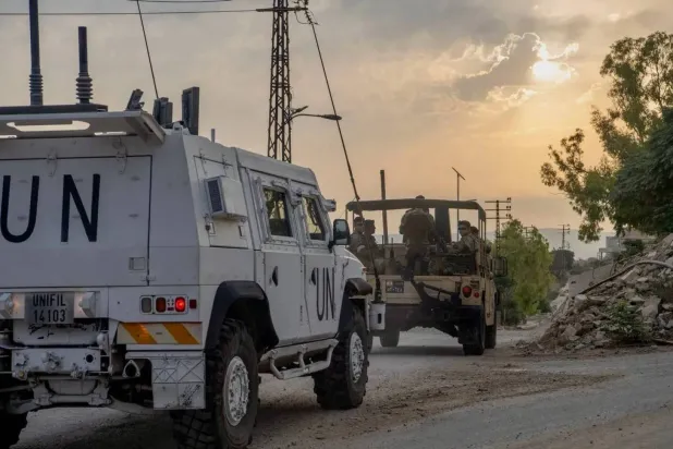 A UNIFIL military vehicle bearing the United Nations emblem moves ahead of a Lebanese army car during a joint patrol (UNIFIL) 