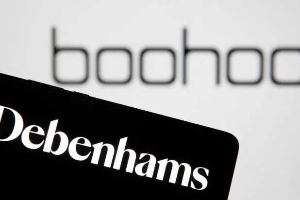 Debenhams logo is seen on smartphone in front of a displayed Boohoo logo in this illustration taken January 25, 2021. (Reuters) 