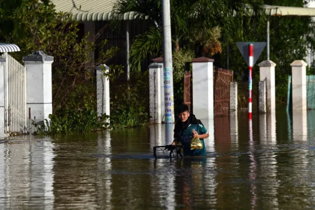 Deadly flooding inundated thousands of homes in Vietnam's Lam Dong province in what authorities say is a record-breaking year of natural disasters. Quoc Nguyen / AFP
