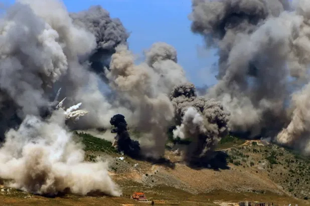 Smoke rises following Israeli airstrikes that targeted the Nabatieh area in May 2025 (Archive – EPA). 