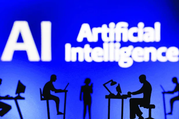 FILE PHOTO: Figurines with computers and smartphones are seen in front of the words "Artificial Intelligence AI" in this illustration taken, February 19, 2024. REUTERS/Dado Ruvic/Illustration/File Photo
