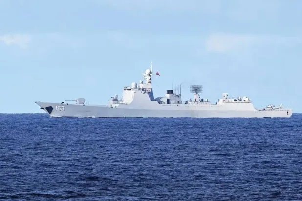 A Chinese PLA navy ship monitors an area during a maritime cooperative activity between the Philippines, Australia and Canadian navy near Scarborough Shoal in the disputed South China Sea on Sep 3, 2025. (AFP) 