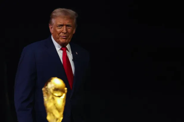WASHINGTON, DC - DECEMBER 05: US President Donald Trump looks on during the FIFA World Cup 2026 Official Draw at John F. Kennedy Center for the Performing Arts on December 05, 2025 in Washington, DC. Patrick Smith/Getty Images/AFP