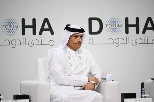 Qatar's Prime Minister and Minister for Foreign Affairs Sheikh Mohammed bin Abdulrahman bin Jassim Al-Thani, attends a session on the opening day of the Doha Forum, an annual diplomatic conference, in Doha on December 6, 2025. (Photo by MAHMUD HAMS / AFP)