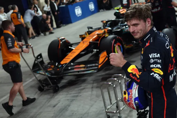 Formula One F1 - Abu Dhabi Grand Prix - Yas Marina Circuit, Abu Dhabi, United Arab Emirates - December 6, 2025 Red Bull's Max Verstappen celebrates after qualifying in pole position REUTERS/Jakub Porzycki