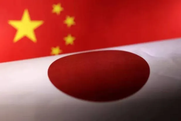 Printed Chinese and Japanese flags are seen in this illustration, July 21, 2022. REUTERS/Dado Ruvic/Illustration Purchase Licensing Rights
