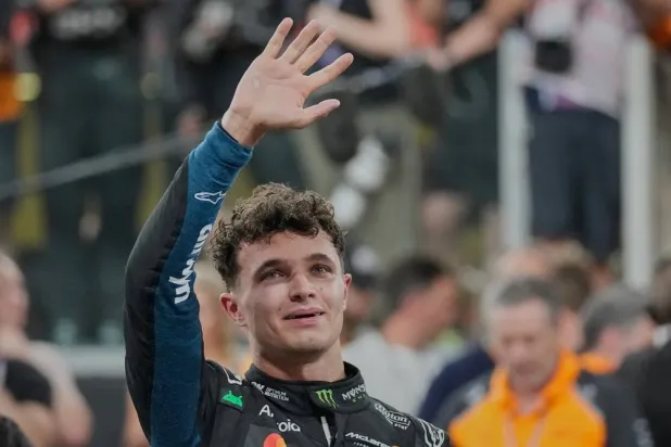  McLaren driver Lando Norris of Britain reacts after becoming a world champion after the Abu Dhabi Formula One Grand Prix in Abu Dhabi, United Arab Emirates, Sunday, Dec. 7, 2025. (AP)
