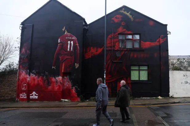 محمد صلاح في كل مكان في ليفربول (رويترز)