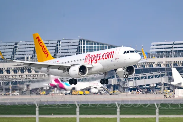 A passenger plane of the ‘Pegasus’ airline lands at the ‘Stuttgart Airport’ in Stuttgart, Germany, Wednesday, May 3, 2023. (Bernd Weissbrod/dpa via AP, File)

