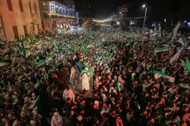 People fill Clock Square to mark the first anniversary of the ousting of the Bashar al-Assad regime. in Homs, western Syria, Monday, Dec. 8, 2025.(AP)