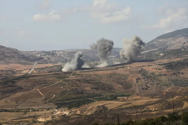 Smoke billows over the village of Aaichiyeh after Israeli strikes, as seen from Marjayoun in southern Lebanon, October 20, 2025. REUTERS/Karamallah Daher
