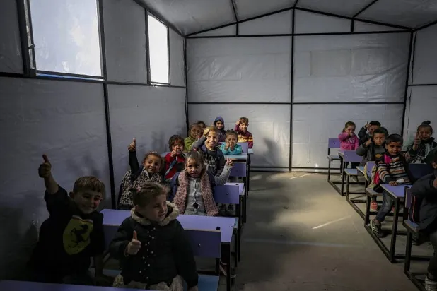 Displaced Palestinian students attend class at a tent school in the Tal Al-Hawa neighborhood in Gaza City, Gaza Strip, 09 December 2025. (EPA)