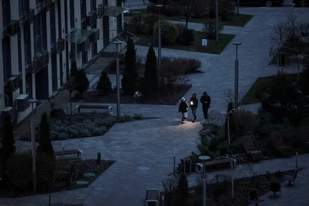  People use a flashlight as they walk during a power blackout after critical civil infrastructure was hit by recent a Russian missile and drone attacks, amid Russia's attack on Ukraine, in Kyiv, Ukraine December 8, 2025. (Reuters)