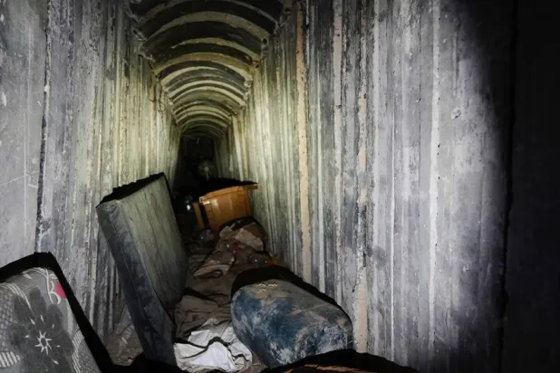 Mattresses and a plastic chair lie on the floor inside a tunnel in Rafah, Gaza Strip, Monday, Dec. 8, 2025. (AP) 