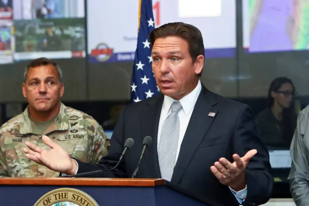 Florida Governor Ron DeSantis speaks about Hurricane Helene as Adjutant General of Florida Major General John Haas looks on during a press briefing at the Emergency Operations Center in Tallahassee, Florida, US, September 26, 2024. (Reuters)