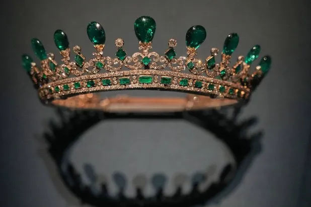The Queen Victoria's emerald tiara, designed by Prince Albert and crafted by Joseph Kitching, London, 1845, emeralds and diamonds set in gold and silver, displayed at the exhibition "Dynastic Jewels" organized by The Al Thani Collection Foundation at the Hôtel de la Marine museum in Paris, France, Monday, Dec. 8, 2025. (AP) 