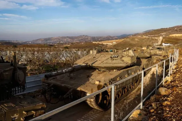 Israeli tanks deployed near the buffer zone on the Syrian Golan, Dec. 8, 2024. (AFP)