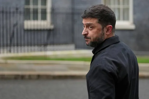 Ukrainian President Volodymyr Zelenskyy, looks back at the media in Downing Street, London, Monday, Dec. 8, 2025. (AP)