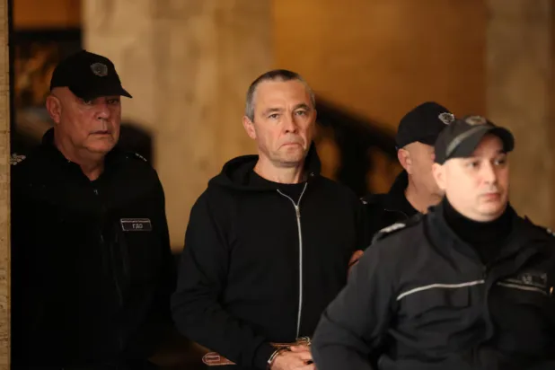 Igor Grechushkin, a Russian businessman based in Cyprus, is escorted by police before the start of his trial on the possible extradition to Lebanon, in Sofia, Bulgaria, December 10, 2025. REUTERS