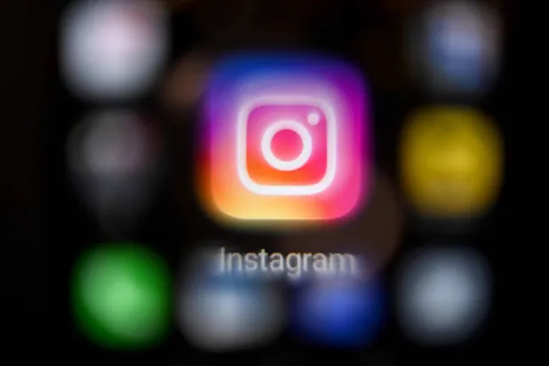 A photo taken on March 14, 2022, shows the US social network Instagram logo on a smartphone screen in Moscow. (AFP)