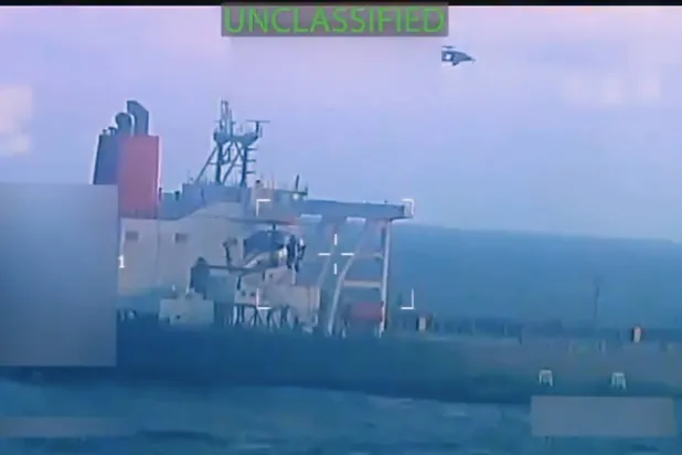 This image from video posted on Attorney General Pam Bondi's X account, and partially redacted by the source, shows an oil tanker being seized by US forces off the coast of Venezuela, Wednesday, Dec. 10, 2025. (US Attorney General's Office/X via AP)
