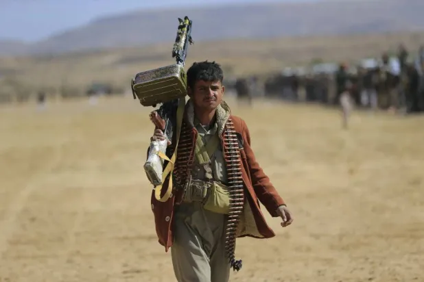 Houthi gunmen display their strength during a gathering north of Sanaa (AFP).  
